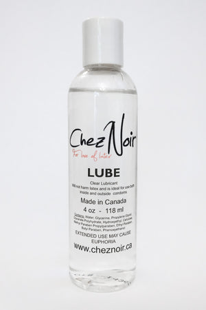A bottle of lube, a latex dressing aid.