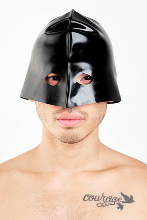 A man wearing a latex executioners mask.
