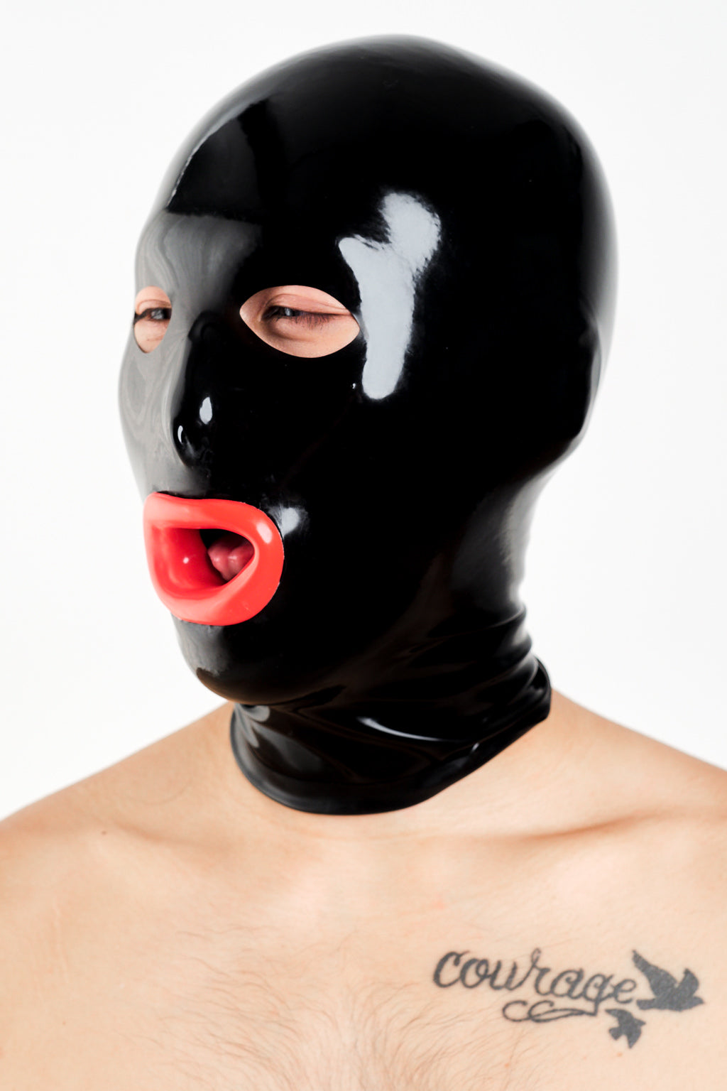 A man wearing a black latex hood with red lips.