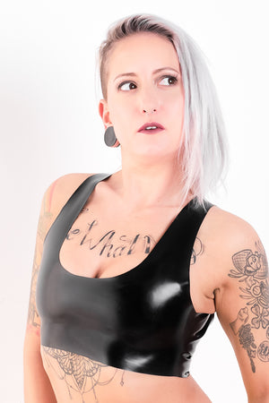 A woman in a latex crop top.