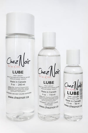 Three bottles of lubricant for getting dressed in latex.