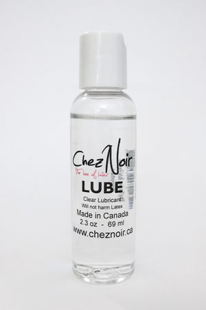 A small bottle of lube, a latex dressing aid.