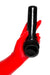 Red latex gloves holding a latex cock and ball penis sheath with ball bag.