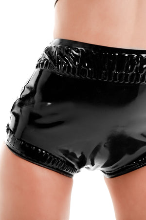 A woman wearing black frilled latex baby pants.