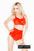 A woman wearing a pair of red high waisted latex underwear with an open crotch and a latex bra.