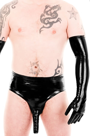 A man wearing black latex shoulder gloves and latex briefs.
